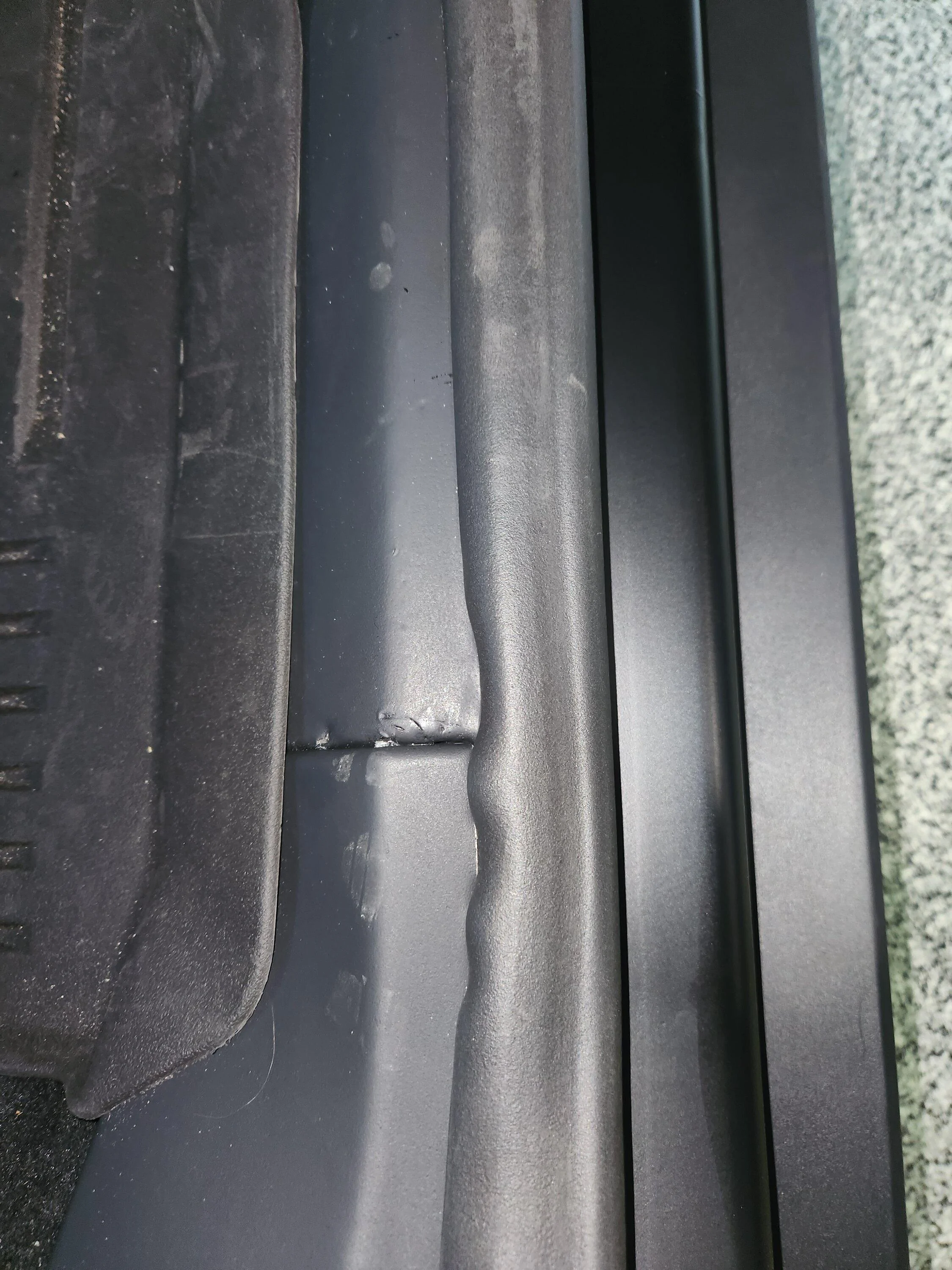 Tesla Roadster 2nd gen Rear passenger interior side sill foam material -- permanent markings / tears 20240514_095620