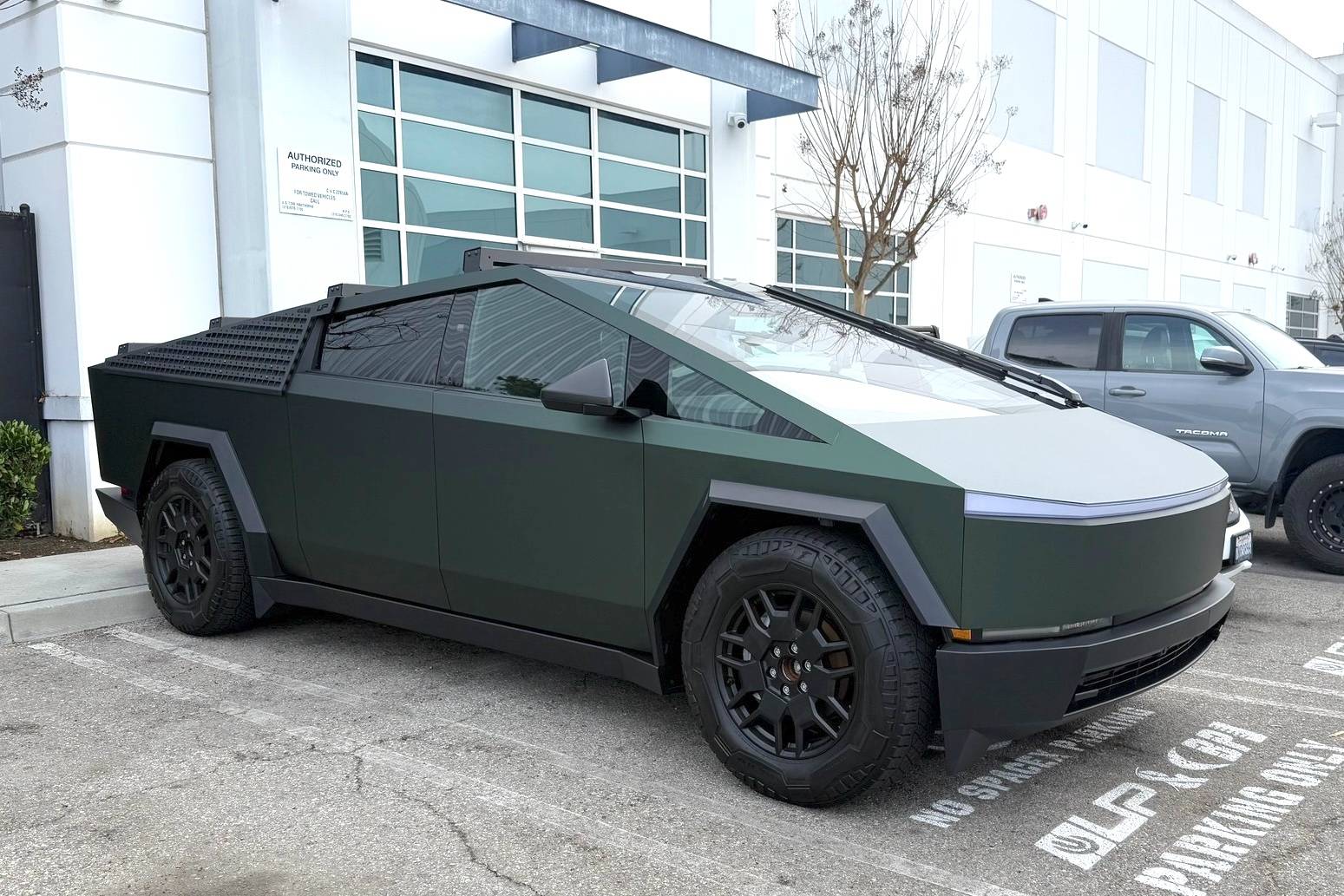 Tesla Cybertruck Customer Cybertruck in PURE PPF Forest Green Wrap, Gyeon Ceramic Coat, UP MOLLE Sails and Roof Racks 472850460_10162810063924673_5853369080018086847_n