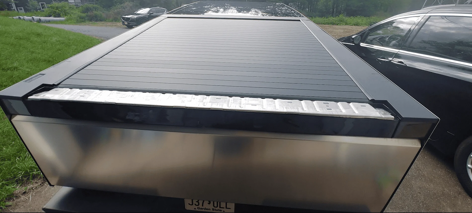 Tesla Roadster 2nd gen Driving down the highway and I lost my tailgate cover... anyone else? cb tailgat