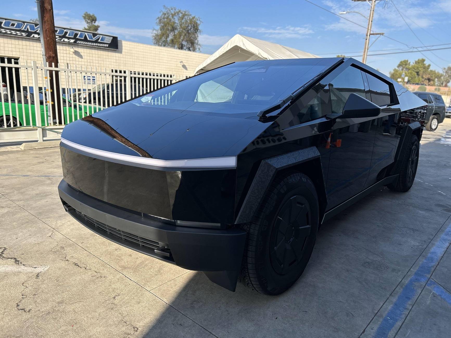 Tesla Cybertruck 🛡️ Camouflage Fenders with Gloss Black PPF?! 🖤✨ Cybertruck gloss black ppf with camo fender flares plastic wrap stickercity (5).JPG