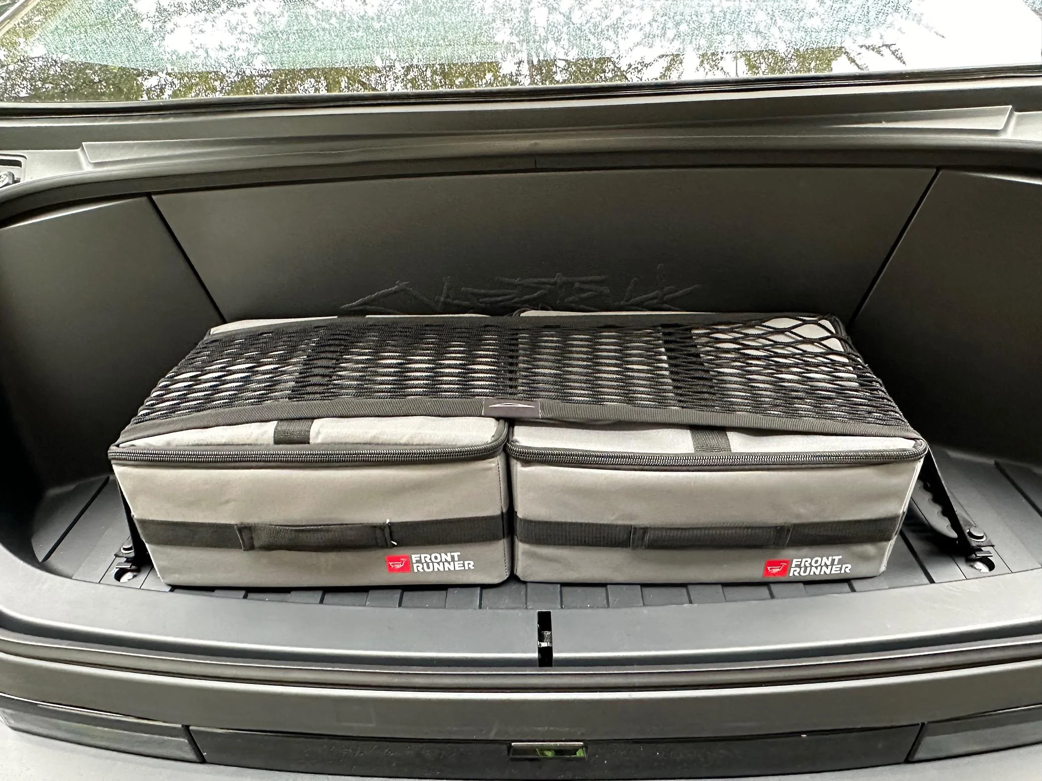 Tesla Cybertruck Love these FrontRunner Flat Packs in my Frunk. IMG_1557