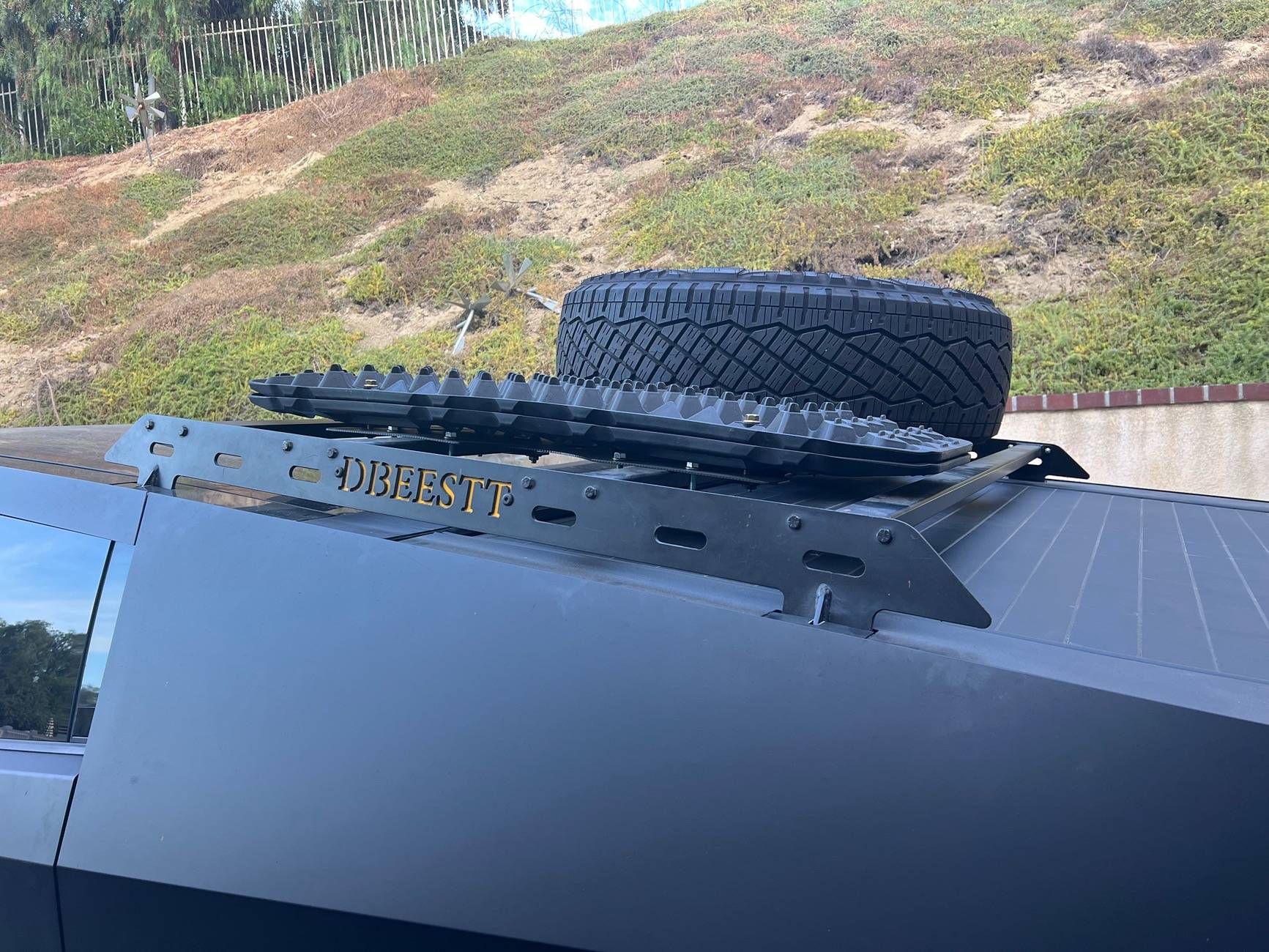 Tesla Roadster 2nd gen Customized roof rack installed with unique spare tire placement IMG_4240