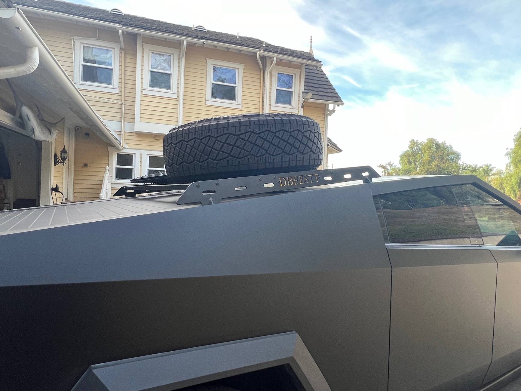 Tesla Roadster 2nd gen Customized roof rack installed with unique spare tire placement IMG_4243