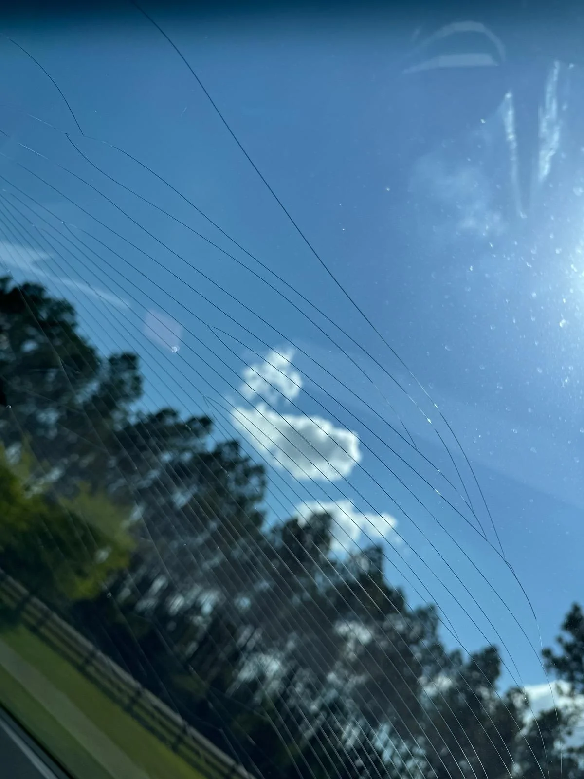 Tesla Roadster 2nd gen Wind Shield Cracked while parked IMG_6898