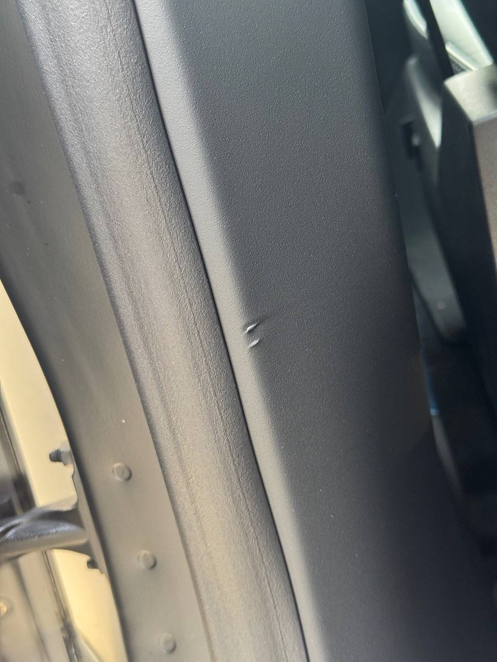 Tesla Roadster 2nd gen Interior damage - staples marks IMG_8304