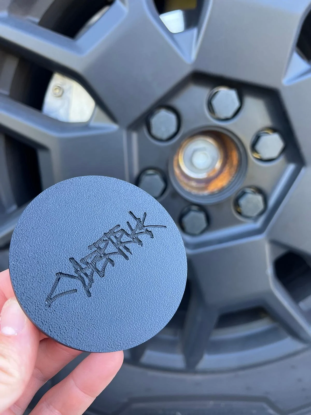 Tesla Roadster 2nd gen Center caps from Amazon fit well IMG_9310