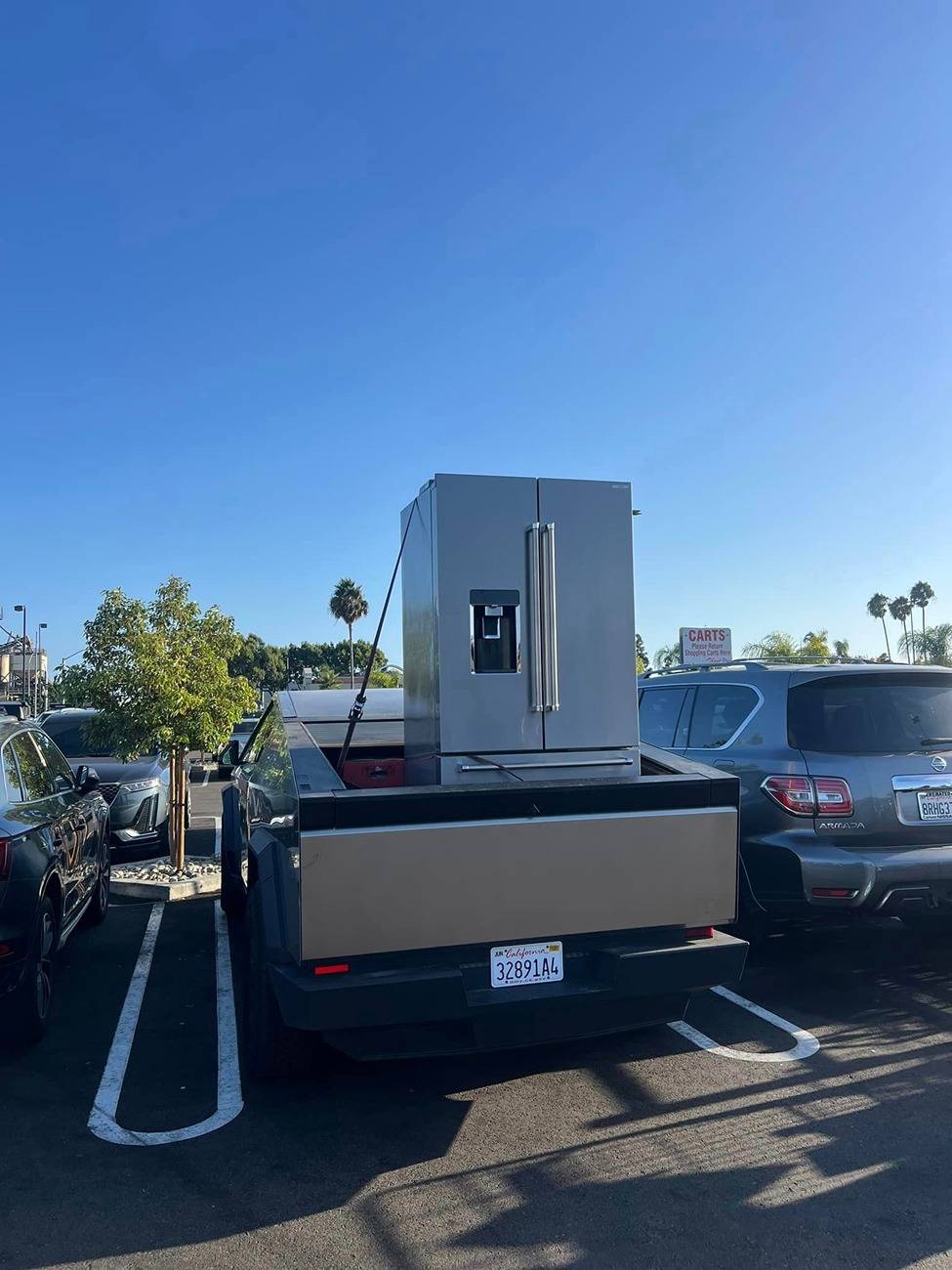 Tesla Cybertruck What Are You Hauling in your Cybertruck? 🦾 👷‍♂️ refirgerator in cybertruck bed 3