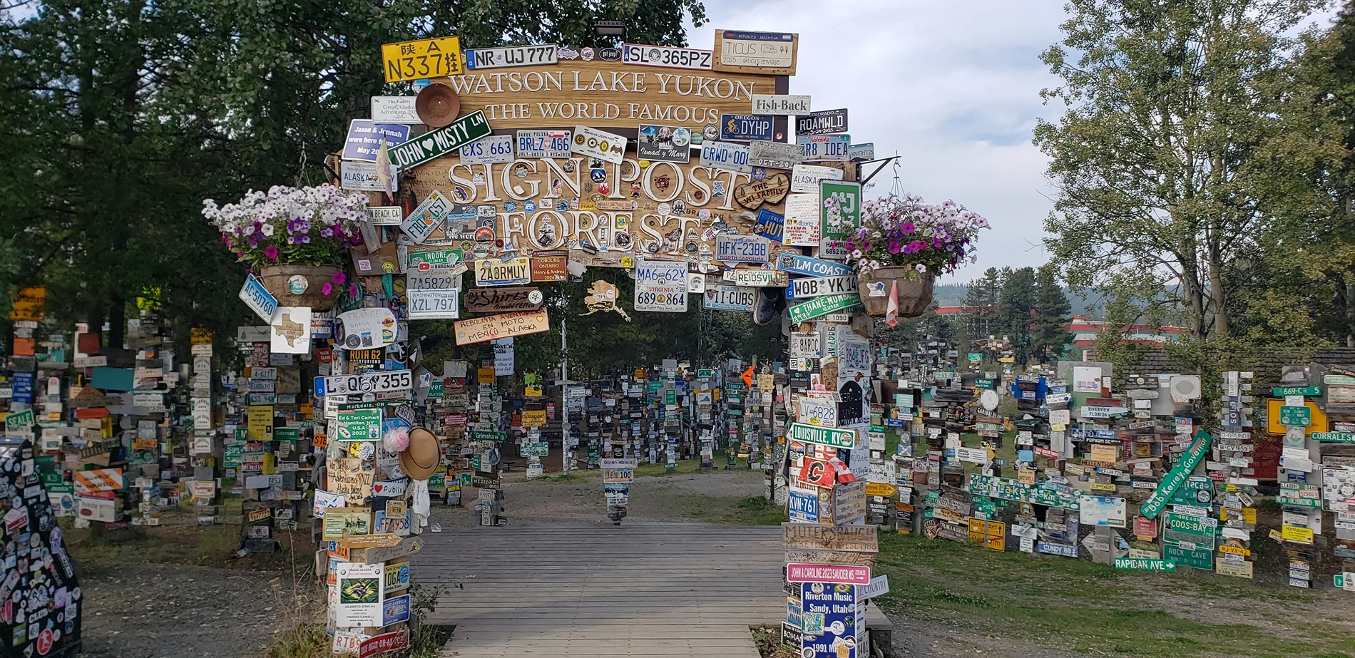 Tesla Cybertruck Overland Trip to Alaska - Follow For Updates Watson Lake Sign Forest